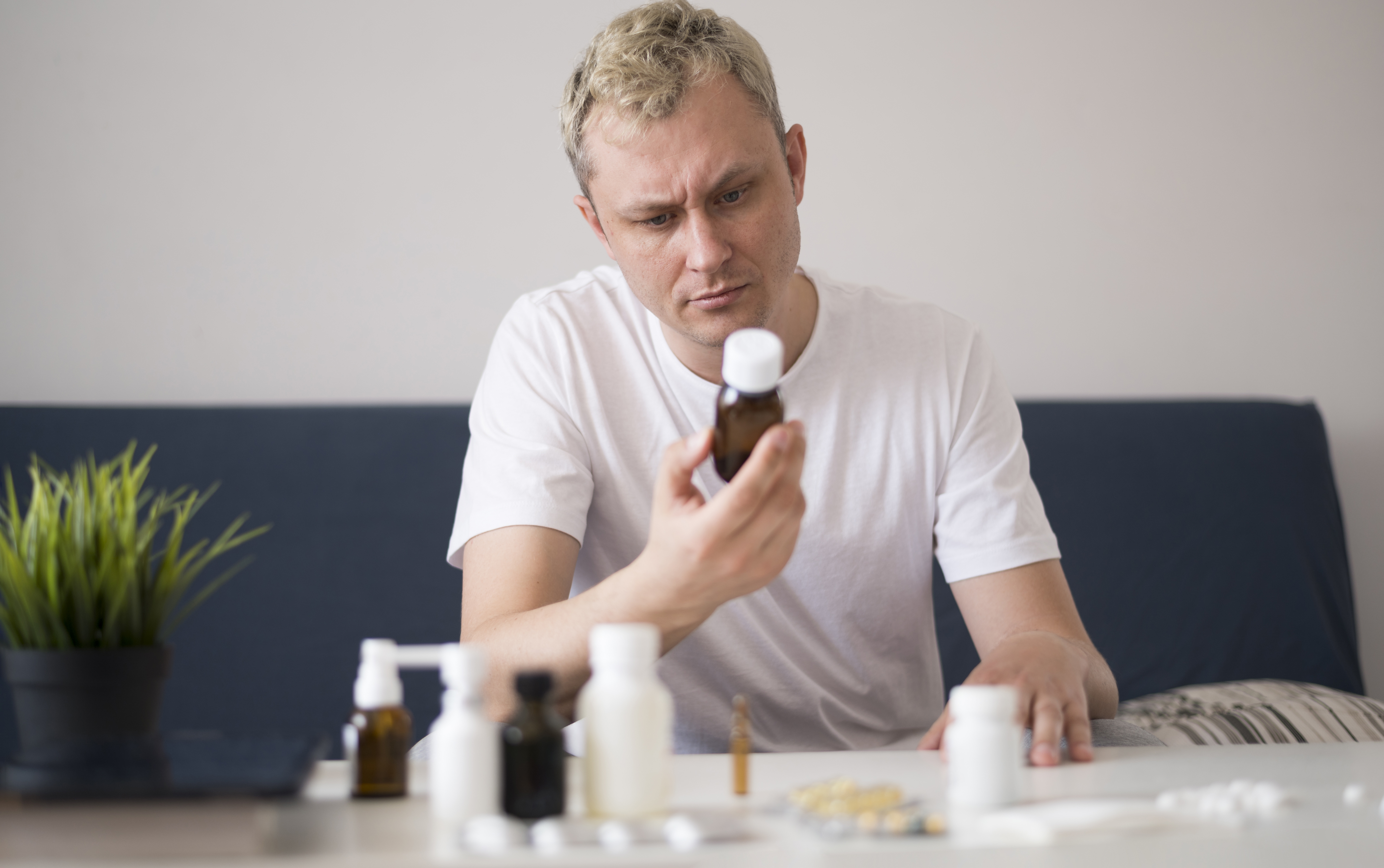 man-reading-from-treatment-glass-container
